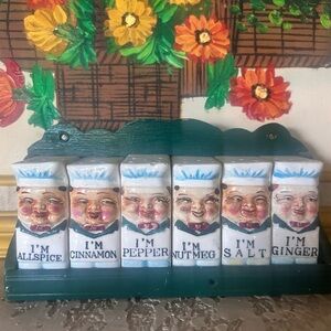 1950s Royal Sealy "Happy Chef" ceramic spice shaker set with wall-mounted rack.